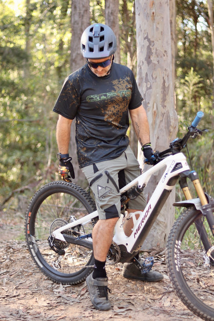 Man on a mountain bike in Australian forest setting wearing Crofto Muddy Jersey and Crofto Apex Pro shorts