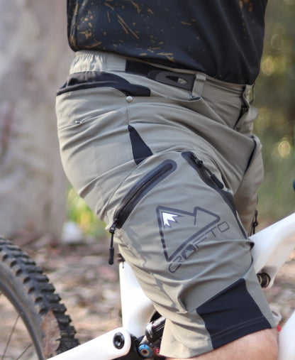 Close up of a person on a mountain bike in a forest setting wearing CROFTO Apex Pro Shorts 