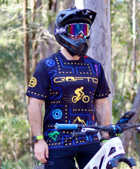CROFTO Trail Maze mountain bike jersey with retro arcade graphics and mountain biking icons, lightweight MTB jersey for trail and enduro riding.