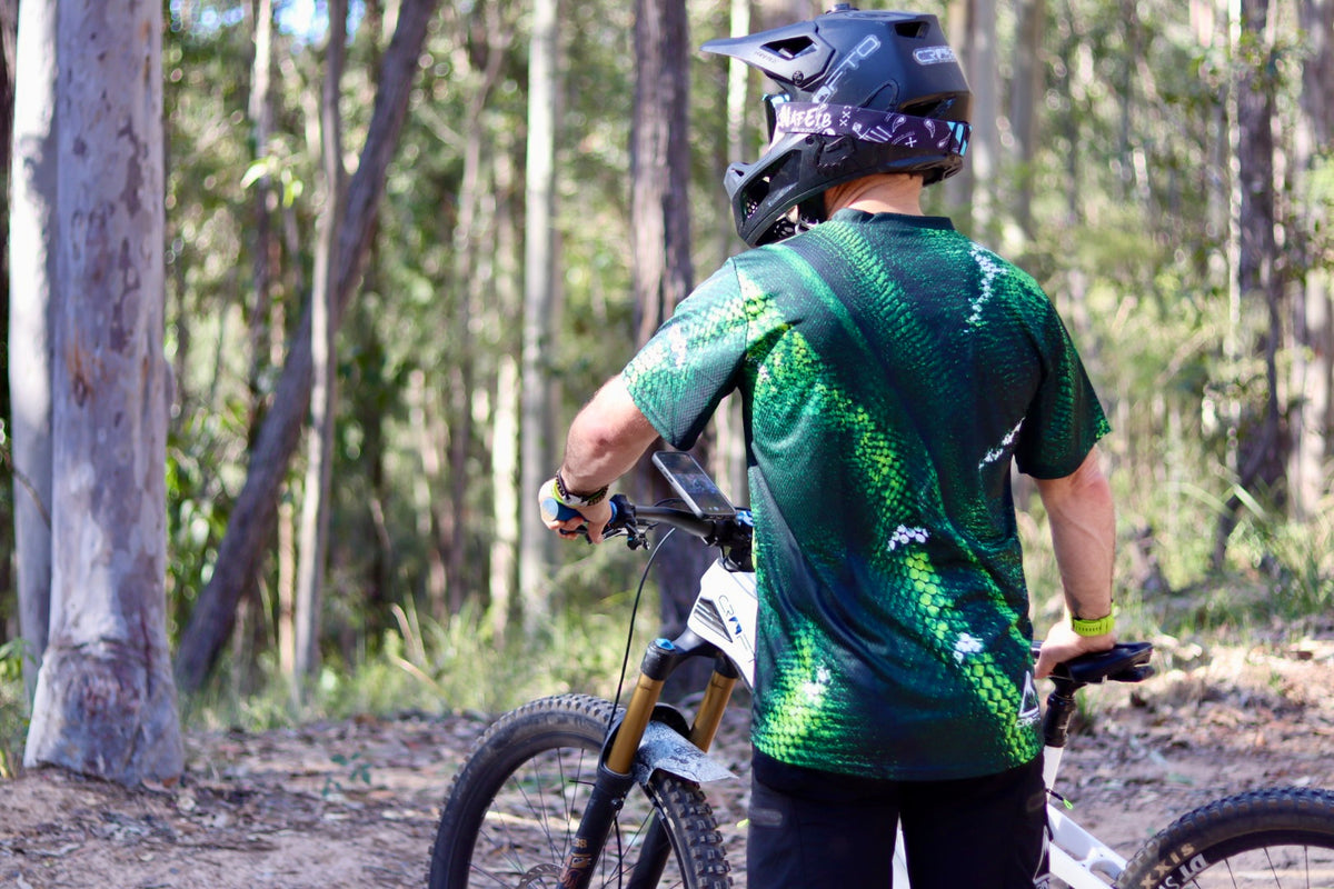Rear view of CROFTO Viper green scale mountain bike jersey, breathable MTB riding jersey for trail and enduro riding.