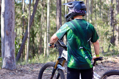Rear view of CROFTO Viper green scale mountain bike jersey, breathable MTB riding jersey for trail and enduro riding.