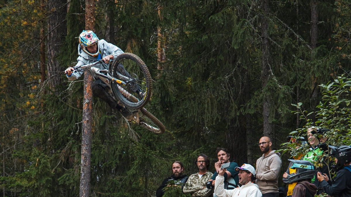 Team rider River doing a big jump on a mountain bike wearing CROFTO soft shell MTB jacket