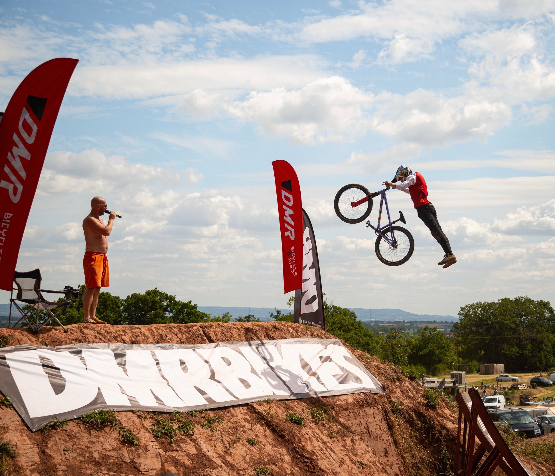 A mountain biker wearing crofto Jekyl jersey and Amaroo pants doing a superman jump at dirtwars competition 
