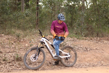 Person on an electric bike in a forest setting