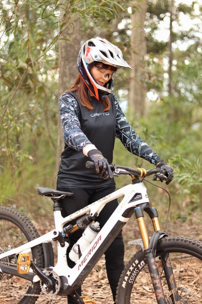 Person on a mountain bike in a forest setting