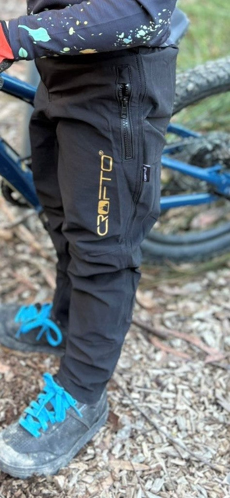close up of a young rider wearing black CROFTO Amaroo MTB pants in Australia