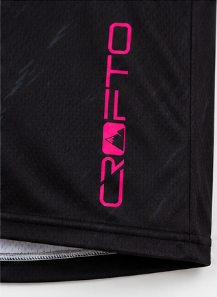 Close-up of the CROFTO Havoc MTB Jersey highlighting vibrant pink splatter graphics and premium performance fabric.