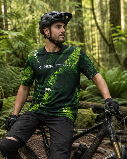 Mountain biker wearing the CROFTO Viper green snakeskin MTB jersey